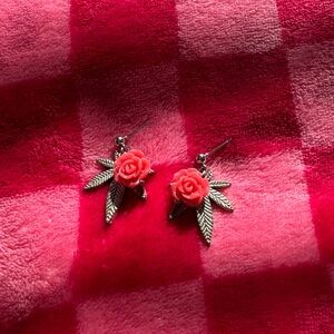 Metal hemp leaf and red rose bud stud earrings